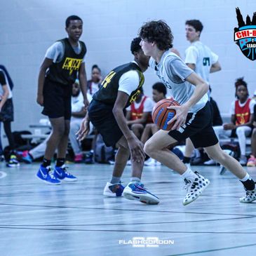 Youth basketball players compete intensely on the court during a game.