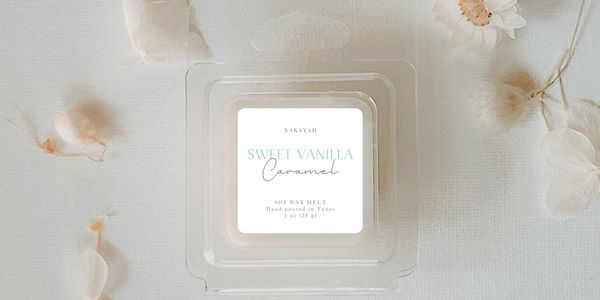 Sweet Vanilla Caramel wax melt on canvas backdrop with flower petals