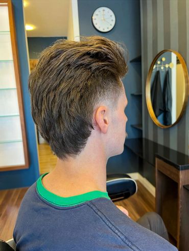 Classic men’s fade with clean lines and a natural finish by Santoro Hair Salon Brighton.