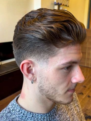 Men’s textured fade haircut styled at Santoro Hair Salon in Brighton. The look features clean, taper