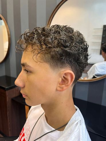 1. Short back and sides with scissor-cut top at Santoro Hair Salon. Sharp, professional look.