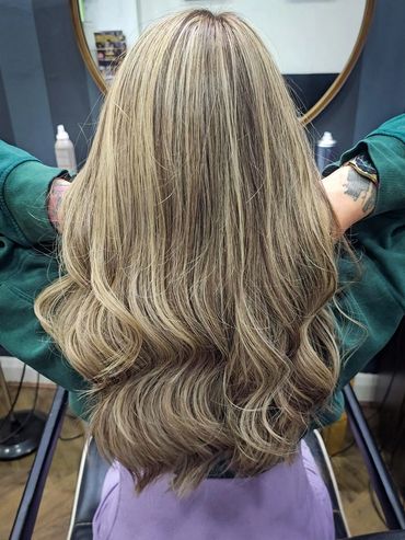Full head highlights and babylights finished with loose waves at Santoro Hair Salon Brighton.