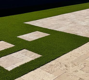 backyard landscape with travertine and turf in Arizona 