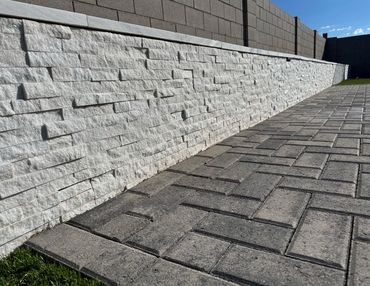 backyard landscape with pavers, retaining wall  in Arizona 