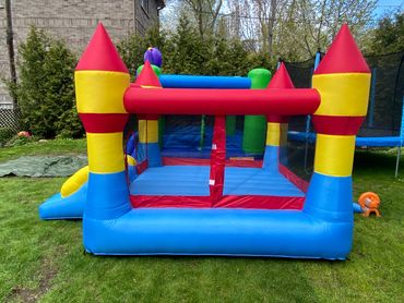 Caines Castles red yellow and blue bouncy castle back view 2