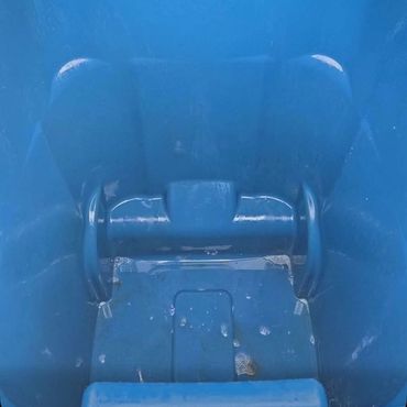 Empty blue plastic container.