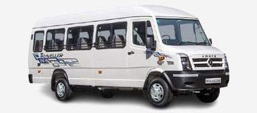 White passenger minibus with tinted windows and black bumper.