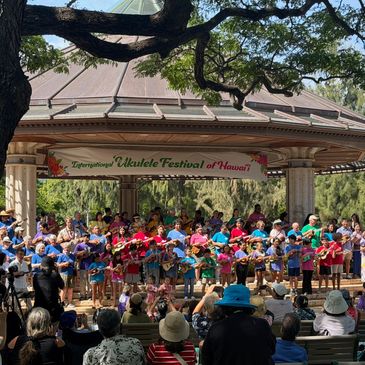 Children perform at the Ukulele Festival of Hawaii stage.