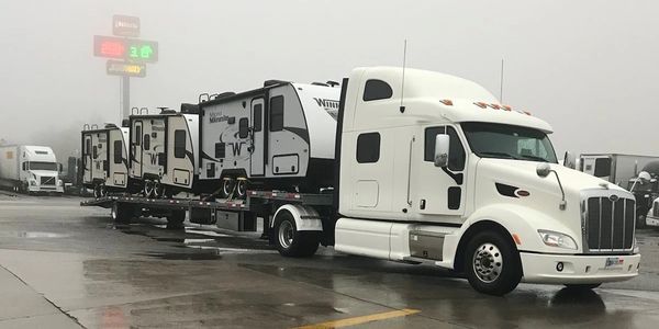 Peterbilt w/loaded trailer at foggy Pilot.