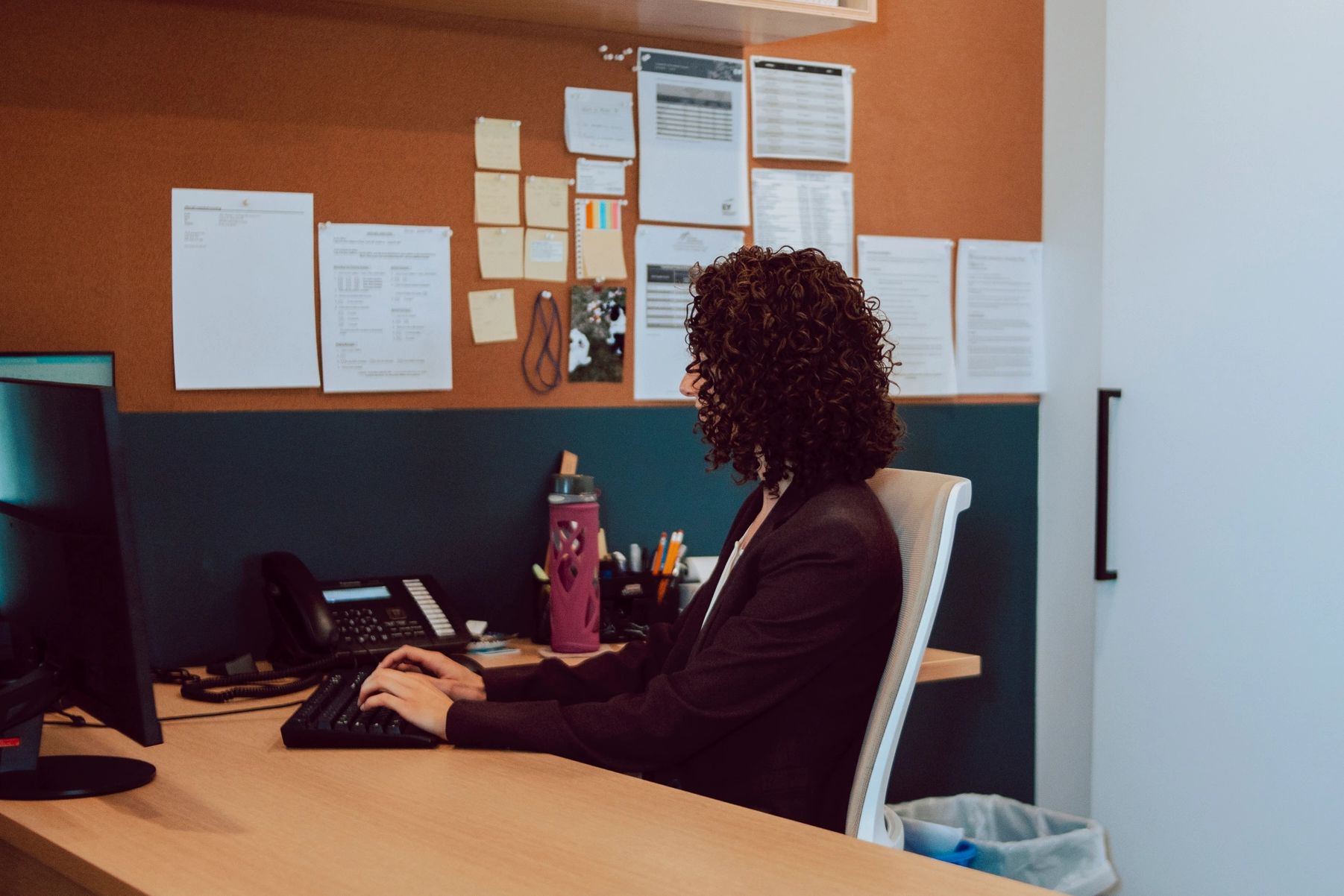 CPA at Creekside Accounting reviewing client financial information in the Kelowna office