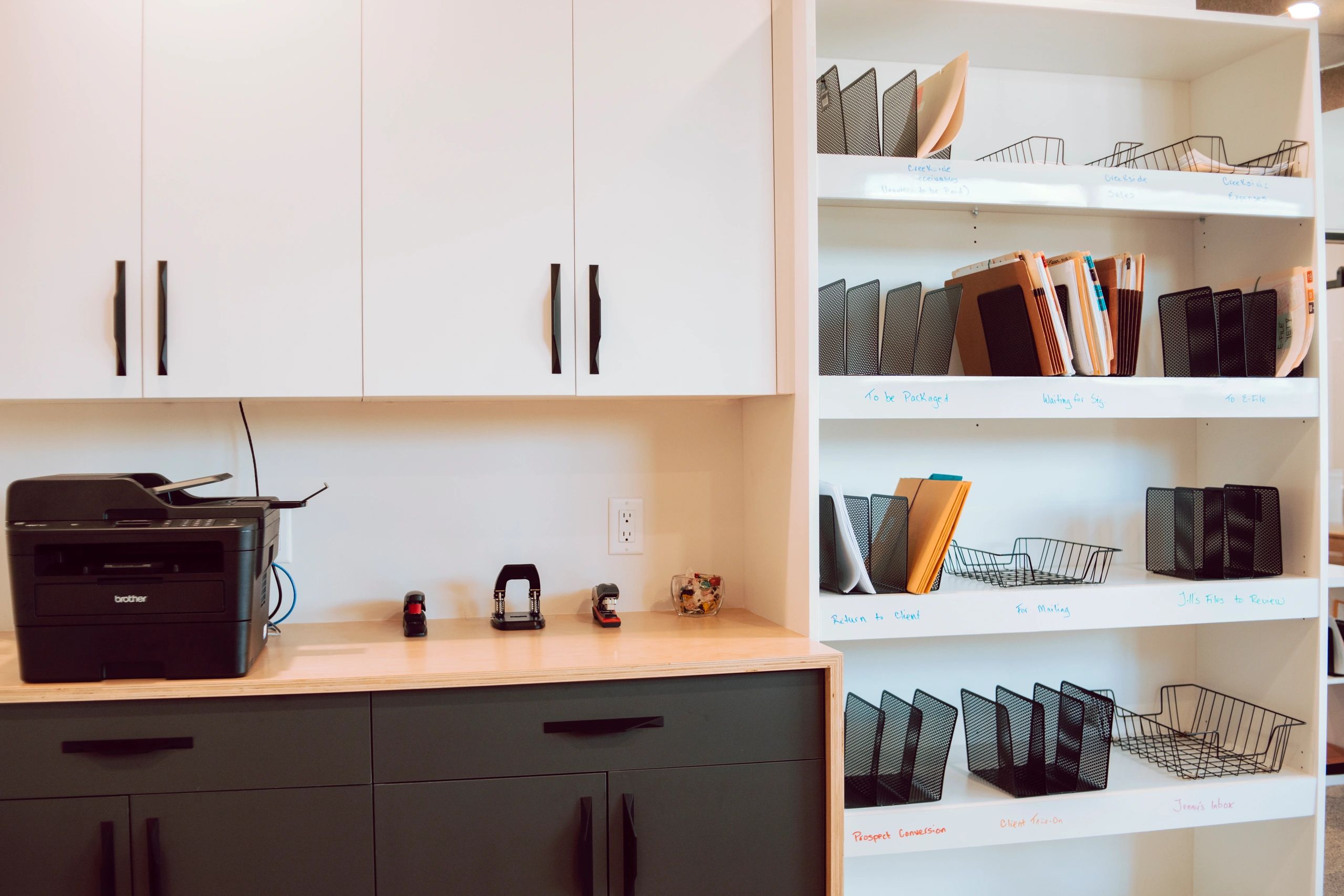 Organized business client files and printer in the Creekside Accounting office in Kelowna