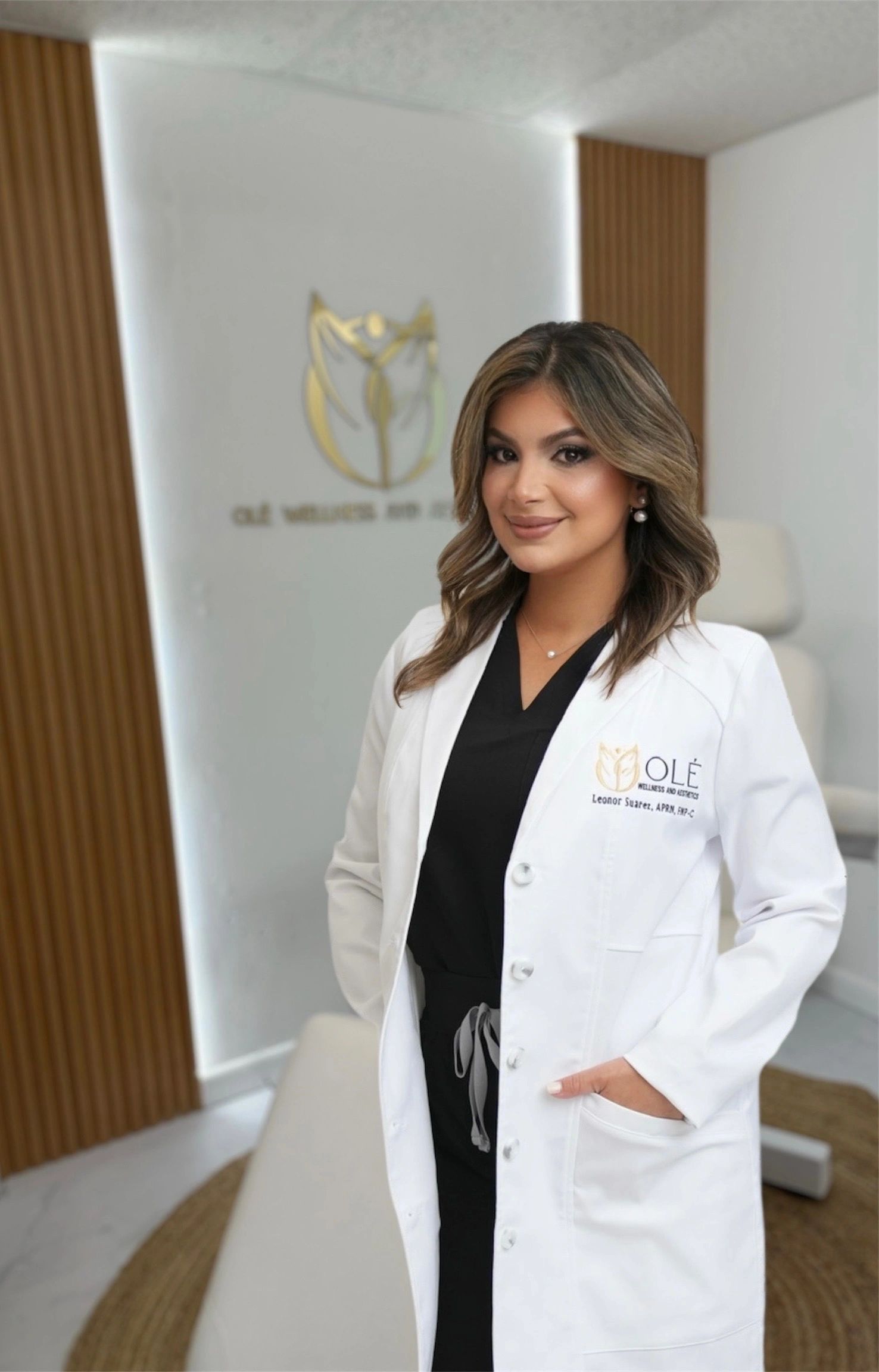 Clean, professional medical spa treatment room with neutral tones at Olé Wellness and Aesthetics in Tampa