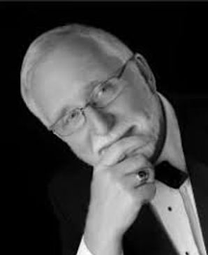 Black and white portrait of a thoughtful man in formal attire.