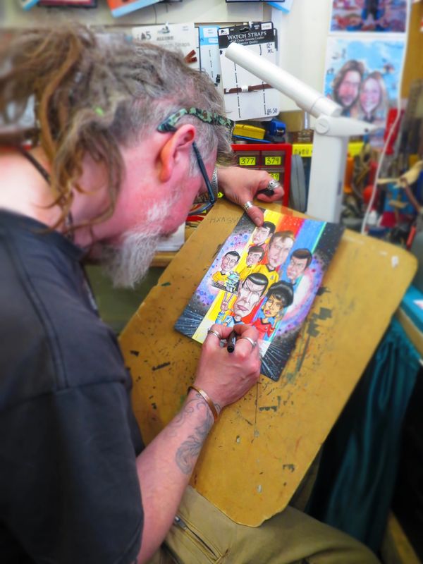 Image of Andy Meanock drawing a caricature of Star Trek.