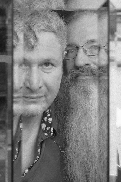 Eclectic indie rock band, Aris Karabelas and Mike Magee of Nom De Plume, black and white photo. 