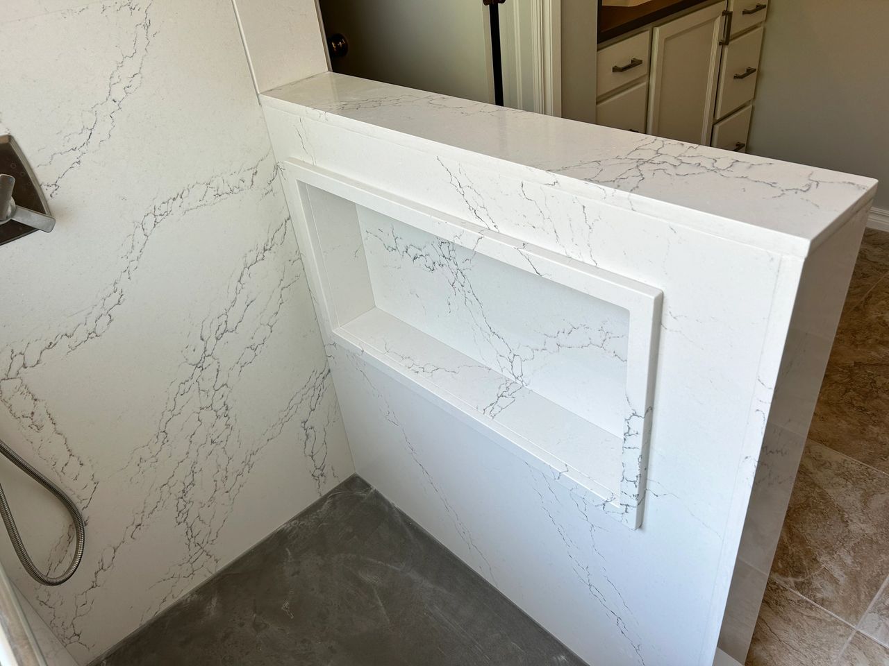 Here is the recessed and hidden cubby for their shampoo, conditioners and soaps built into the pony wall.