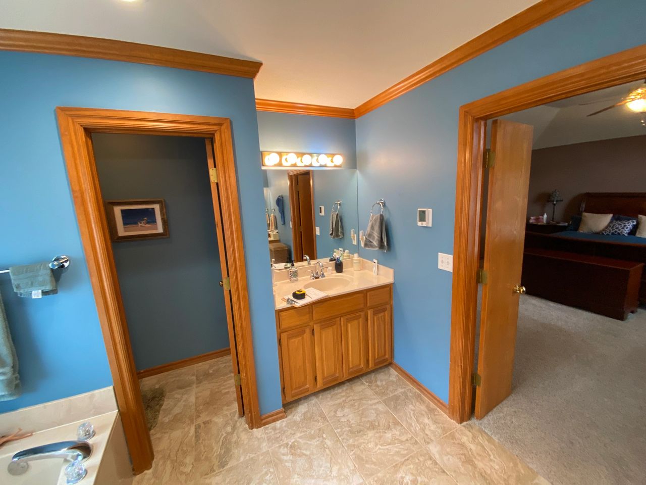 More pictures of his side of the bathroom and the storage he has with his vanity.