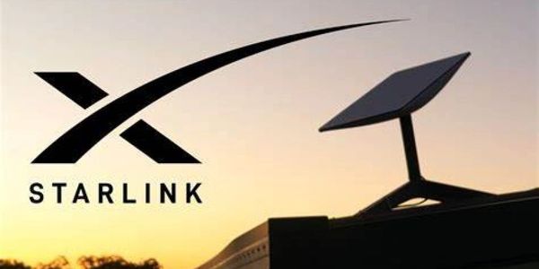 Starlink logo beside a satellite dish against sunset.
