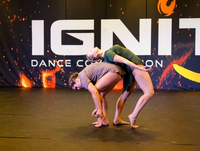 A duet where the dancers are leaning against each other at Ignite Dance Competition.