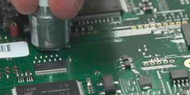 Hand probing a PCBA
