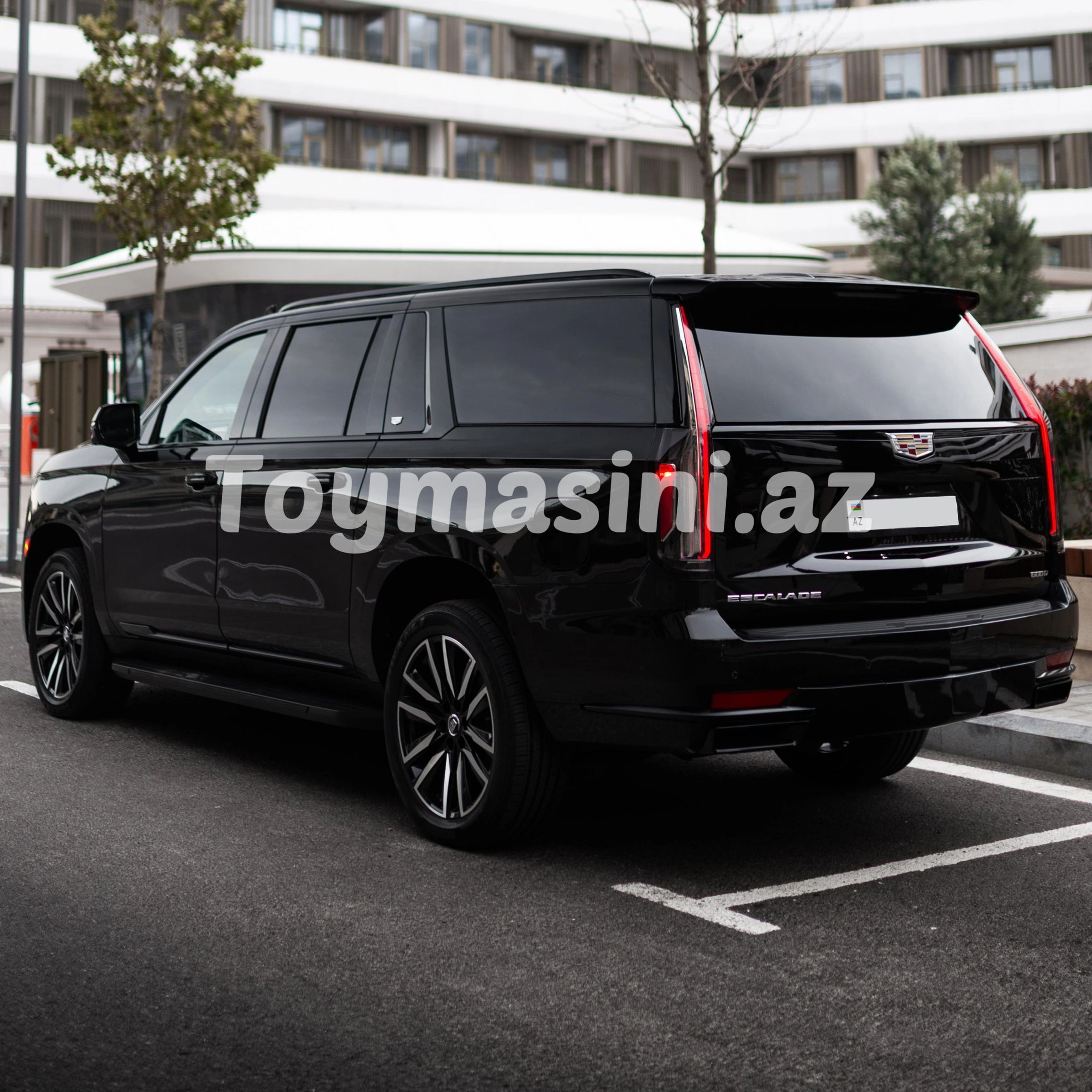 Black Cadillac Escalade in an urban setting.