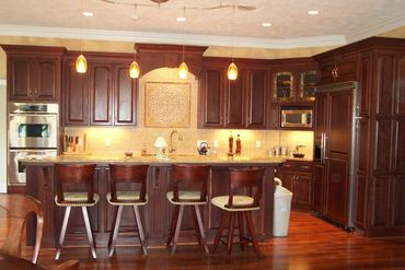 custom kitchen complete with mosaic tile backsplash