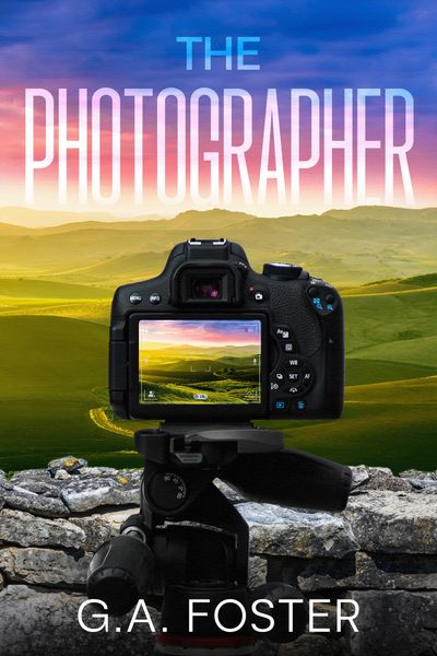 Camera capturing a scenic landscape with bold title 'The Photographer'.