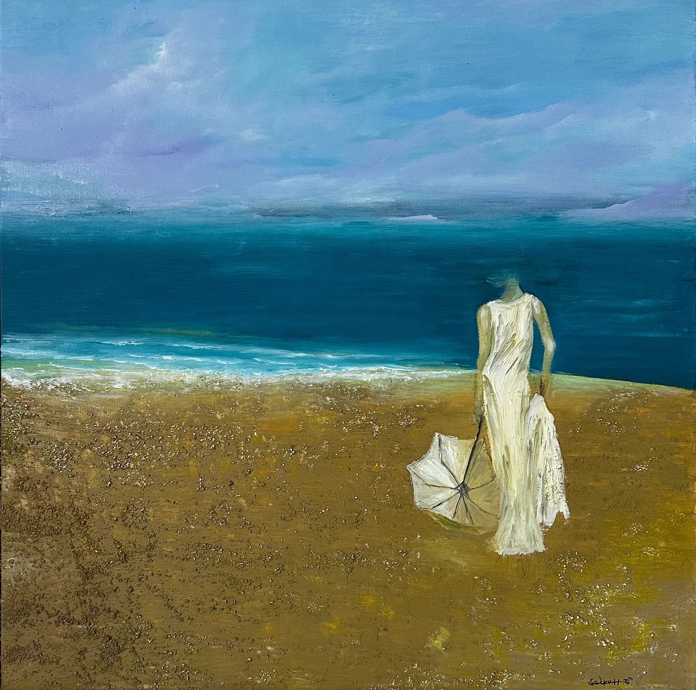 Serene beach scene with cliffs and umbrella near the shoreline.