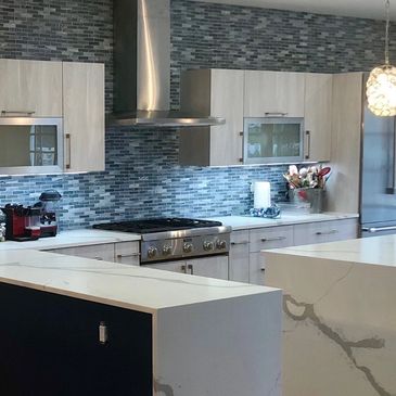 kitchen remodel backsplash hood range oven granite counter countertop waterfall edge glass tile