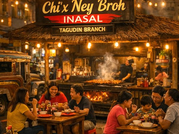 People enjoying grilled food at Chi'x Ney Broh Inasal restaurant.