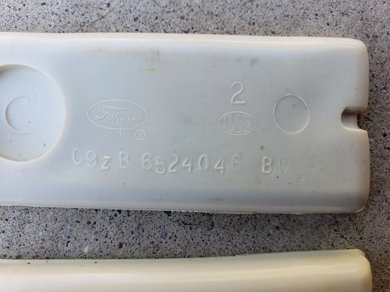The underside of the rubber insert showing the C9ZB engineering number.