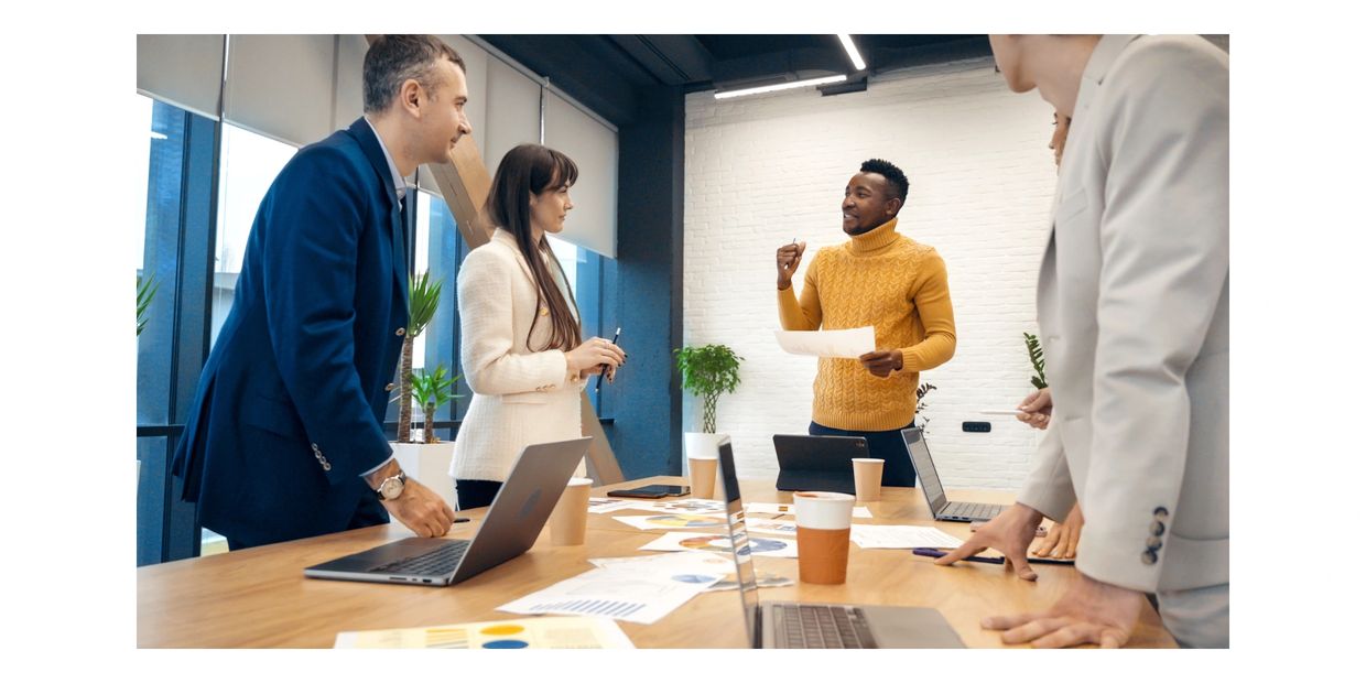 a meeting between a team member of Numberssmith and clients.