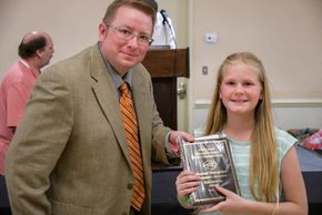 Photo of Mr. David Richardson and a female NDYA bowler