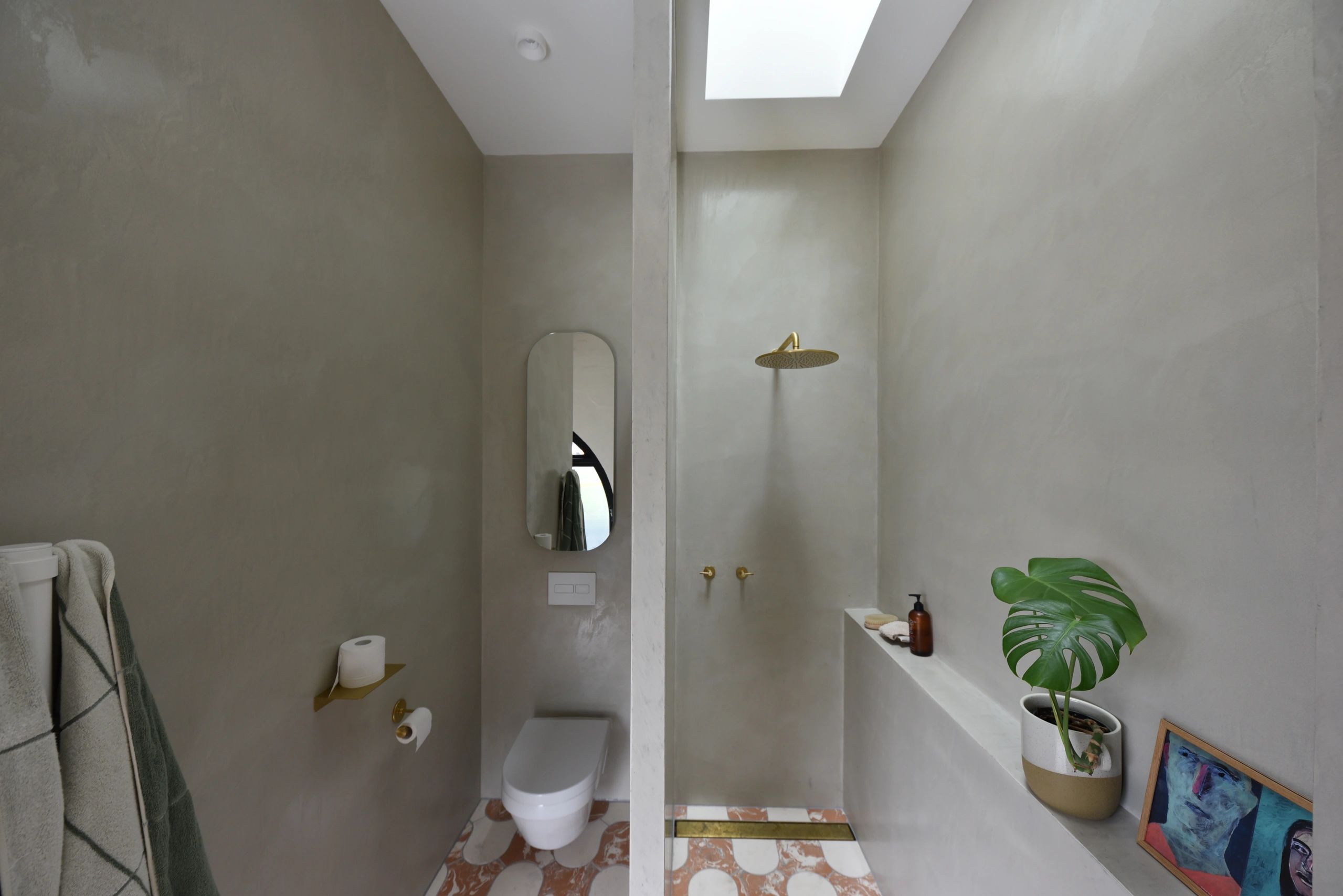 Quality bathroom renovation in Queens Park. Venetian plaster with hand made tiles. 
