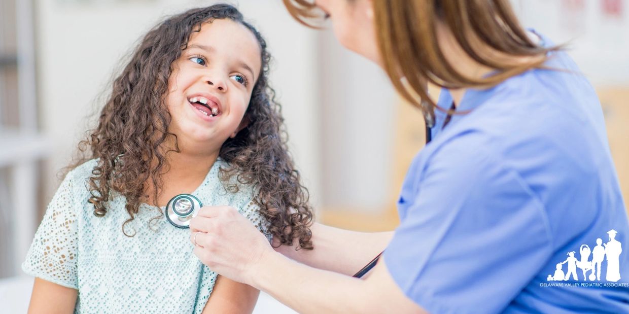 A girl sitting in a pediatric office