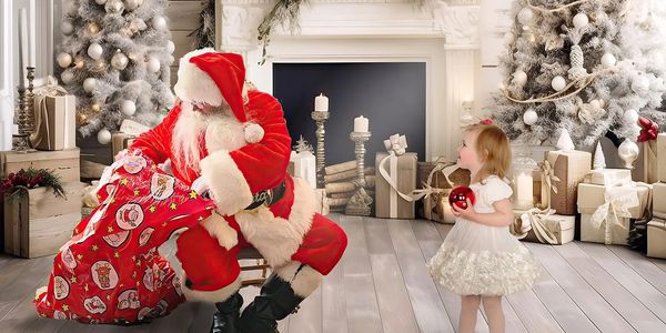 Santa Claus giving gifts to a little girl in a festive room.