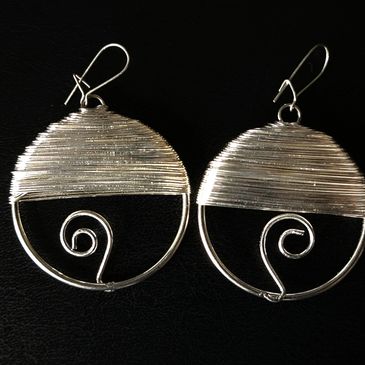 1 Pair of silver-wrapped earrings.