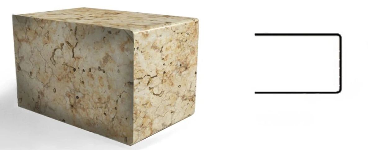 A stone block with rounded edges next to a U-shaped black metal bracket.