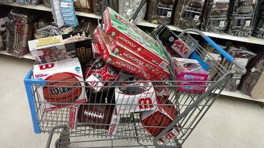 A shopping cart with a board games in it 