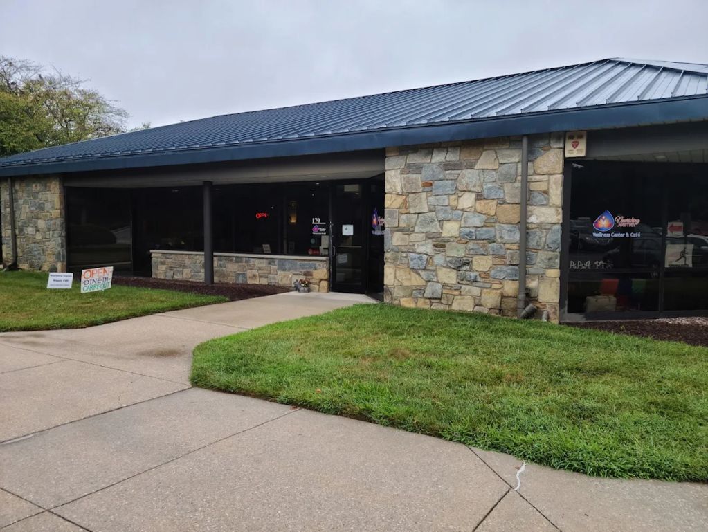 Exterior of a wellness center building with stone facade.
