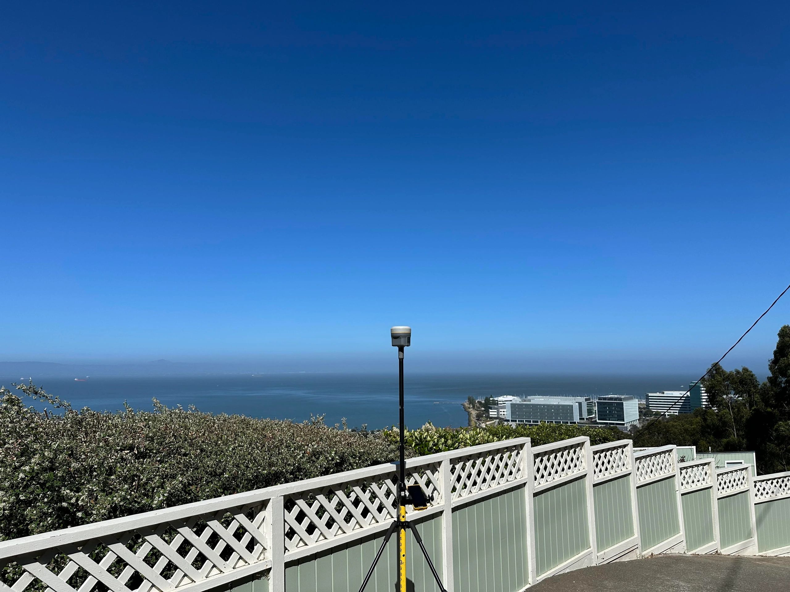 Surveying equipment overlooking the bay on a sunny day.