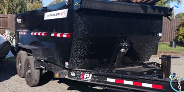 Black 14 feet long dumpster trailer.  With a capacity of 14 yards. A mobile Dumpster on wheels.