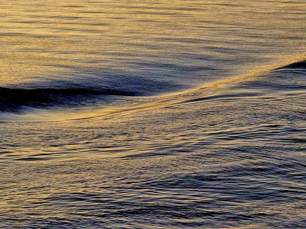 Wake of a ship in Winter Light at Sunset. Norway, leaving Bergen