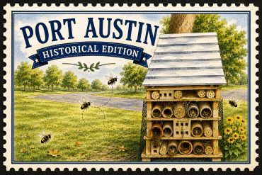 Stamp featuring Port Austin Historical Edition with bees and a wooden bee house.