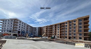 Apartment complex under construction labeled BMC 2000.
