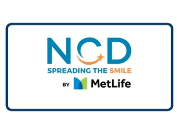 NCD Spreading the Smile by MetLife logo with a blue and orange theme.