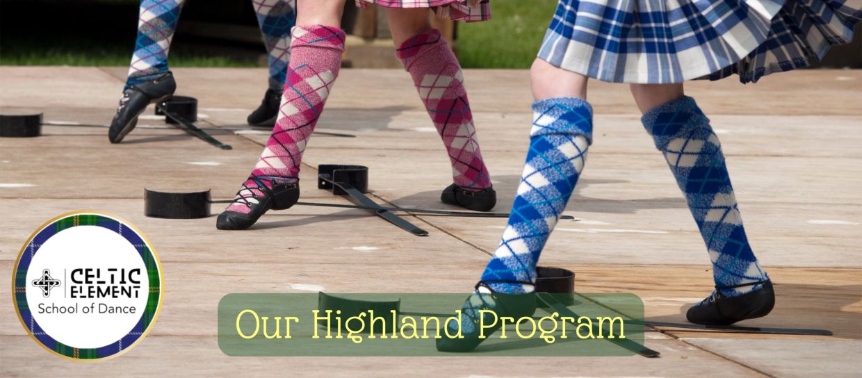 Dancer in full Highland costume performing over swords.