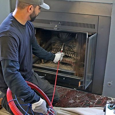 Technician Cleaning chimney in Memphis, Tennessee and surrounding areas 