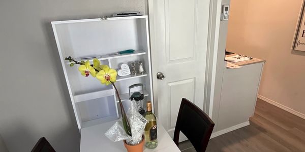 Eat, study and work at this convenient wall table with storage for your office materials.