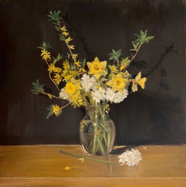 daffodils, forsythia, narcissus flowers in glass vase